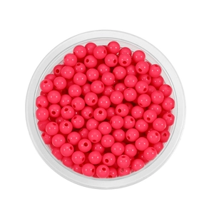 Detailed view of 6mm bright rose red acrylic beads in a tray for DIY jewelry making
