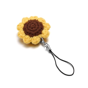 Handmade crochet sunflower keychain with yellow petals and black lanyard strap