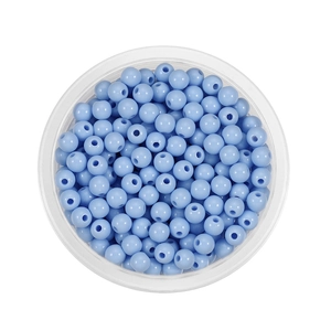 Macro shot of 6mm light blue acrylic round spacer beads for DIY jewelry making and crafts
