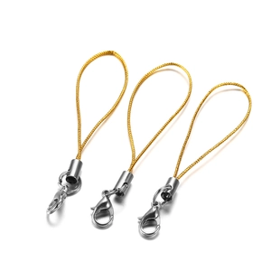 Close-up of three gold nylon cords with silver metal lobster clasps for DIY accessories