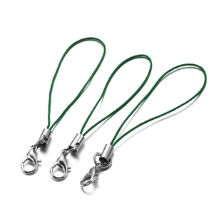 Close-up of green nylon lanyards with silver lobster clasps and metal tube connectors