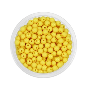 Top view of 6mm yellow acrylic spacer beads for DIY jewelry making in a round container