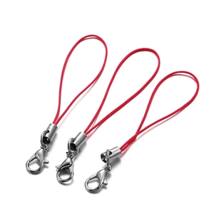 Detailed view of red nylon cords with silver lobster clasps for DIY jewelry and phone charms