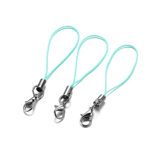 Detail of three mint green nylon lanyards with silver lobster clasps and metal end caps