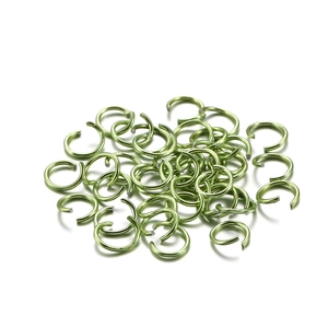 Close-up of light green aluminum jump rings for DIY jewelry making and linking