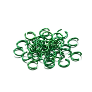 Close-up of bright green aluminum jump rings for DIY jewelry and bracelet assembly