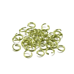 Close-up of numerous golden open jump rings for DIY jewelry making and connecting