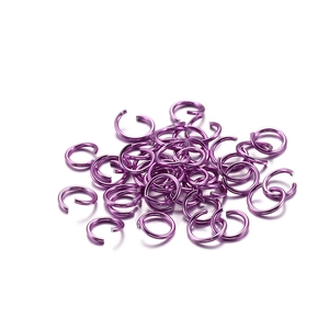 Macro shot of purple open jump rings made of vibrant anodized aluminum for DIY jewelry making