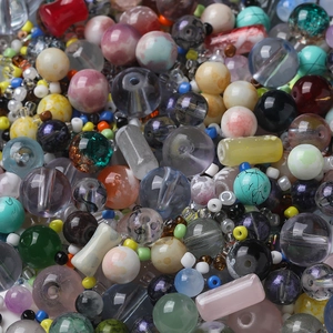 Macro shot of colorful 3-14mm assorted beads with marble textures for DIY jewelry crafts