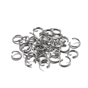 Pile of silver open jump rings for DIY jewelry making and bracelet chain assembly