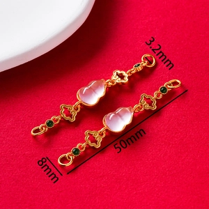 Detailed view of traditional gold gourd pendant with pink jade and green beads 50mm