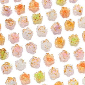 Macro view of assorted resin rose beads with gold edges and glitter for DIY nail art