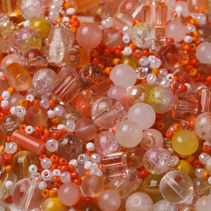 Mixed orange and yellow DIY beads set in various shapes including round and cubic styles