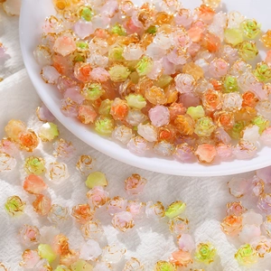 Macro view of colorful resin rose beads with gold-edged finish for DIY jewelry