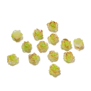 Macro detail of light green resin rose beads with elegant gold-rimmed petal edges