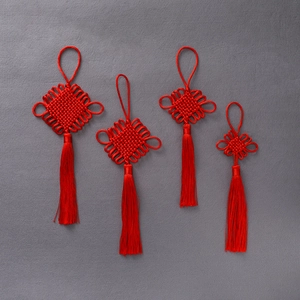 Set of four traditional red Chinese knots with silk tassels for festive home decoration