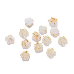 Macro detail of white resin rose beads with gold edges for DIY jewelry crafting