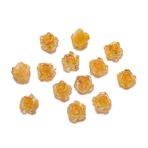 Macro shot of 13 pieces of amber resin rose beads for DIY jewelry making material