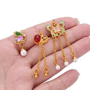 Traditional Chinese gold-plated pendants featuring butterfly, lotus, and pearl tassels