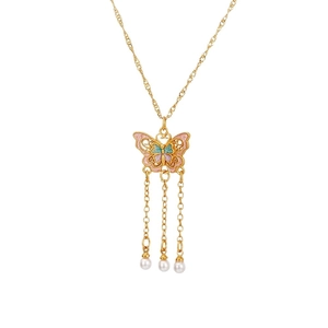 Elegant gold butterfly necklace with colorful enamel wings and pearl tassel pendants