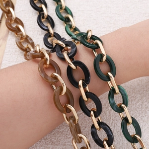 Detail of 62cm acrylic handbag chain straps with amber, black and green marble resin rings