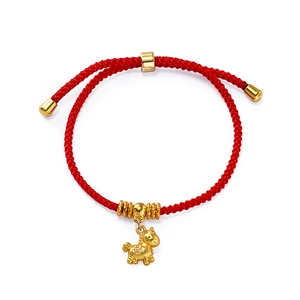 Detailed view of red woven cord bracelet featuring a gold horse charm and adjustable clasp