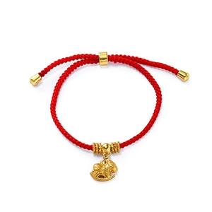 Detailed view of red woven lucky bracelet with a golden rocking horse charm and beads