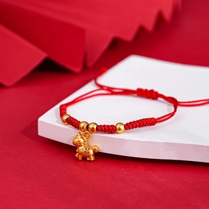 Macro view of Chinese New Year red woven bracelet with golden horse charm and beads