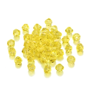 Détails macro de perles en cristal bicone jaune de 4mm pour la création de bijoux DIY