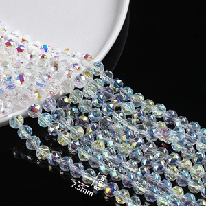 Macro detail of faceted 7.5mm and 8mm crystal glass beads with AB coating for DIY jewelry