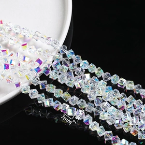 Macro detail of 7mm and 7.5mm cube faceted crystal beads with AB rainbow coating