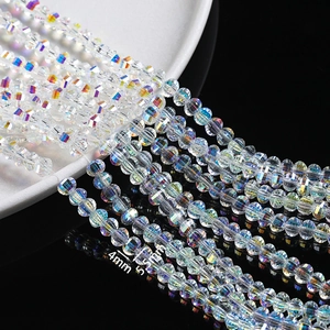 Macro view of 4mm and 5.5mm faceted iridescent glass crystal beads for DIY jewelry