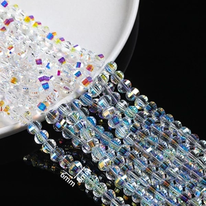 Macro detail of 6mm and 8mm faceted crystal glass beads with iridescent AB rainbow coating