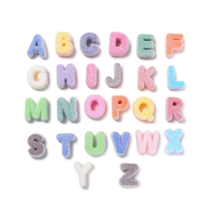 Macro shot of 26 colorful chenille letter patches with vibrant towel embroidery