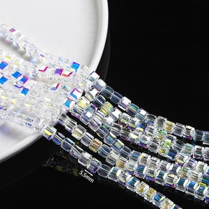 Macro view of 5.5mm cubic iridescent crystal glass beads with precision facets for DIY