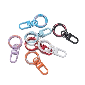 Detail view of colorful donut pattern spring gate rings with rotating D-hooks for DIY bags