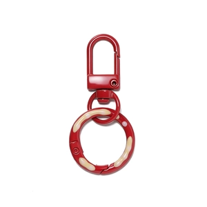 Detailed close-up of 5cm red lacquer spring buckle with yellow wave donut pattern