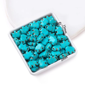 Detail of 15mm turquoise elephant beads for DIY jewelry making with natural vein texture