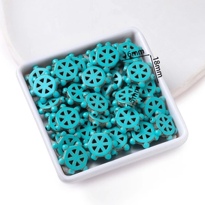 Detail view of turquoise gear beads with dimensions 18mm diameter and 7.5mm thickness