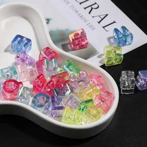 Macro detail of colorful translucent acrylic alphabet beads for DIY jewelry making