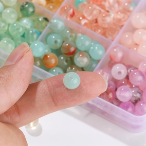 Macro detail of 8mm colorful acrylic stone beads for DIY jewelry making and crafts