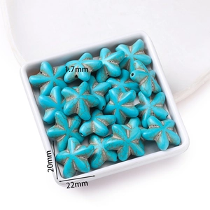 Detail of starfish shaped turquoise resin beads measuring 22x20mm for DIY jewelry making