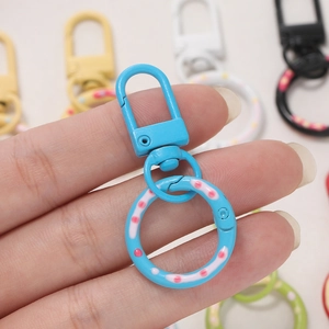 Detail of 5cm sky blue swivel spring clasp with pink polka dots for DIY keychains