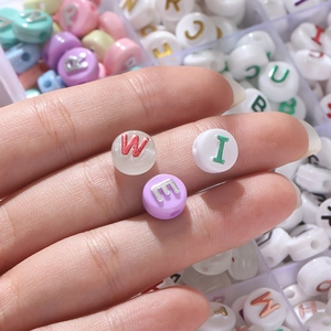 Macro shot of 6x10mm acrylic letter beads for DIY bracelet jewelry making