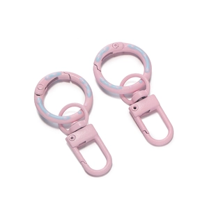 Macro detail of pink painted 5cm spring ring clasp with 360-degree swivel hook and D-ring