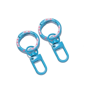 Detail of blue polka dot swivel spring ring and U-shape lobster clasp with painted finish