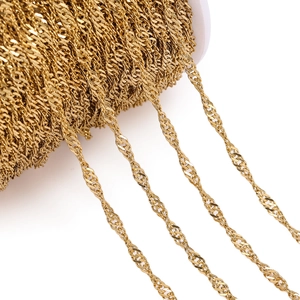 Detailed view of golden titanium steel water wave chain on a white spool for DIY jewelry