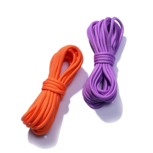Close-up of 5mm colorful braided nylon cords in orange and purple for DIY crafts