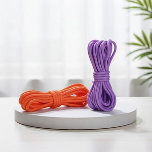 Detail of 5mm colorful core-spun braided nylon ropes in orange and purple for DIY crafts