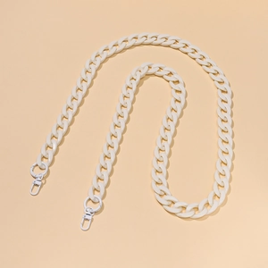 Close-up of a white acrylic chunky chain strap with lobster clasps for handbags